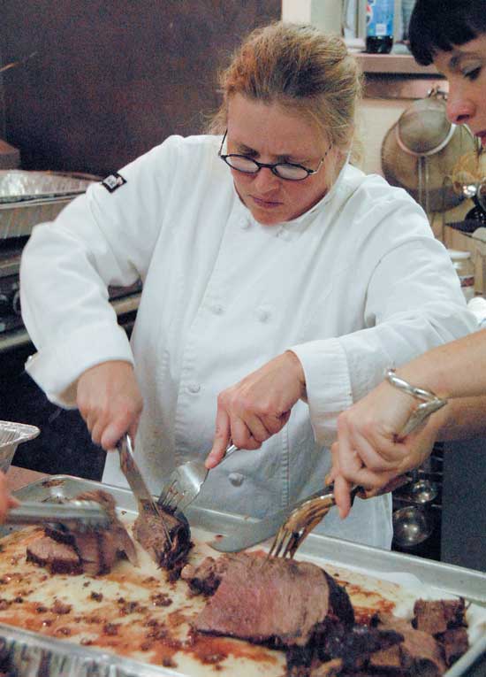 B.J. Pessia, who catered the event, carves some good-looking beef.