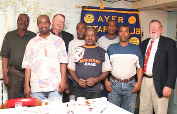Guests of honor at a recent Ayer-Harvard-Shirley Rotary Club meeting are (left to right) Donald Morris, Desmond Sappleton, Bruce Carlson, Eustace Francis, LaSalle Parks, Orthniel Downs, Errol Brown, and Frank Carlson. (Photo by Lisa Aciukewicz)