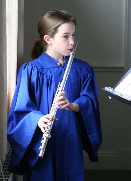 Sixth-grader Alyssa Asquith plays “O Come Little Children” during a dress rehearsal.