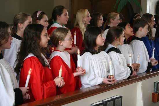 Choir members sing “Now Light 1,000 Christmas Lights.” Front row (left to right): Kelly O’Shea, Heather Flokos, Jenny Specht, Jillian Nelson, Lexi Dutkewych, Jennifer Symula, Ryan Kennedy, Kara Kennedy. Back row: Caroline Turnbull, Kaley Pappas, Caroline Hart, Henley Siegrist, Alice Kennedy, and Erin Molinaro.
