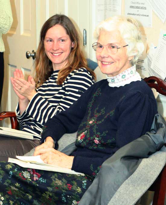 Sarah Arnold (left) claps for her mother-in-law Anne Marie Arnold as Ann Marie is honored for starting the town’s Messiah sing 41 years ago. 