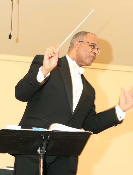 Maestro Ted Johnson leads the orchestra and chorus.