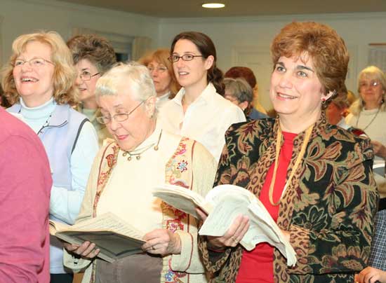Left to right: Joanna Bickford, Lucy Wallace, Naomi Newell, Kathrine Wallace, and Dee Glorioso join in with the other altos. 