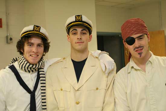 At the Snowflake dance, DJ Evan Clark (center), The “Captain of the Dance” poses with his first mate, Patrick Coffey (left) and Mike Hulit, the leader of the pirates. (Photo by Rob Williams)