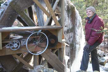 On a cold day in January, John Zimmer stands next to the waterwheel he built in his basement last winter. (Photos by Lisa Aciukewicz) On a cold day in January, John Zimmer stands next to the waterwheel he built in his basement last winter. (Photos by Lisa Aciukewicz)