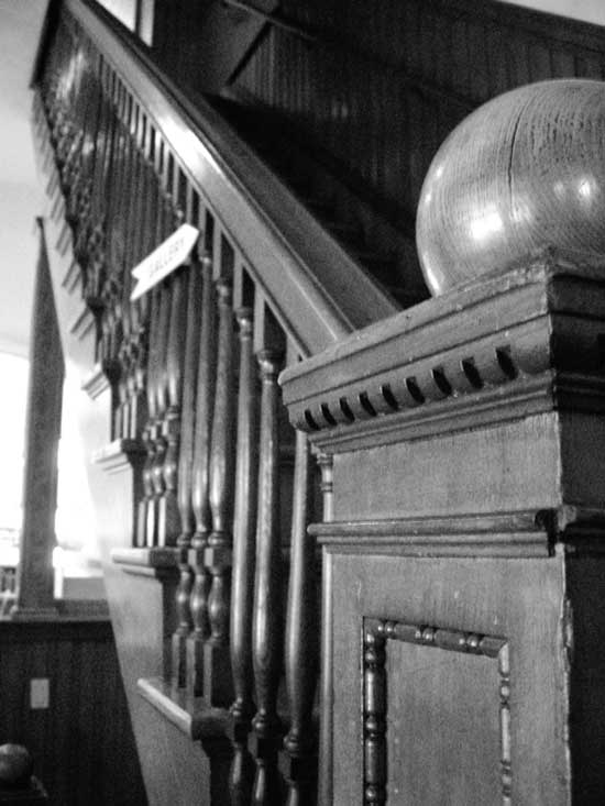 Detail of the bannister in the old library. (Photo by Stephen Into)