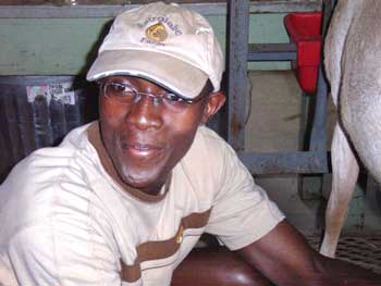 Joseph Kivaa takes a break from chores at Mary Craumer's farm. (Courtesy photo)