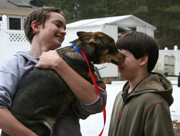 Scott Blackwell of Willow Road holds Carmen, a Corgi/German Shepherd mix puppy who gives a dog’s welcome to Erik Johnson of Old Mill Road. (Photo by Lisa Aciukewicz) Scott Blackwell of Willow Road holds Carmen, a Corgi/German Shepherd mix puppy who gives a dog’s welcome to Erik Johnson of Old Mill Road. (Photo by Lisa Aciukewicz)