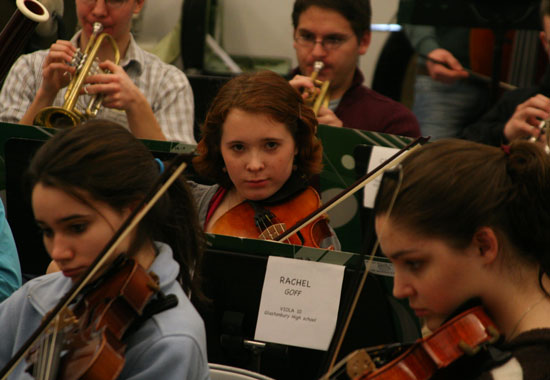Bromfield's Kristina Kronauer (center) plays viola in the orchestra.