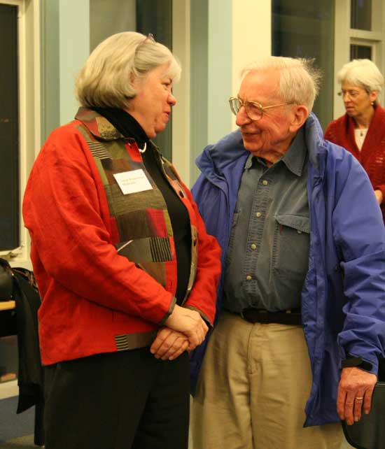 Debate moderator Susan Wasserman chats with Jeff Harris.