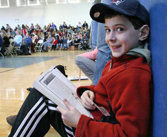 Fourth-grader Matthew Polimou gets some homework done.