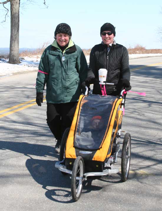 Carol Hoffman and Kimberly Hoffman walk up Prospect Hill Road as Douglas McDonough naps in his stroller.