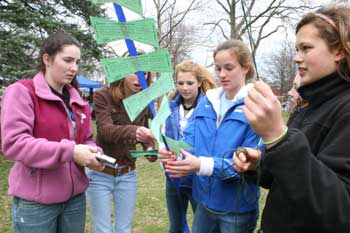 Jordan McDonnell, Lisa Reedich, Elise Bilodeau, Emily Reedich, and Erica Schwiegershausen attach signed bow-tie petitions to the strips to be delivered to legislators. (Photo by Lisa Aciukewicz) Jordan McDonnell, Lisa Reedich, Elise Bilodeau, Emily Reedich, and Erica Schwiegershausen attach signed bow-tie petitions to the strips to be delivered to legislators. (Photo by Lisa Aciukewicz)