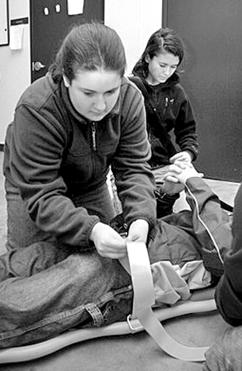 Mary Ferrillo and Corey Bradley at EMT training. (Photo by Rob Williams)