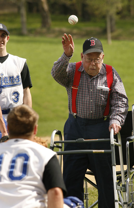 Charlie Perkins throws out the first pitch before the Bromfield Trojans faces off against the West Boylston Lions on Pond Road last week. At 93, Perkins is the oldest known former Bromfield baseball player. (Photo by Ellen Harasimowicz) Charlie Perkins throws out the first pitch before the Bromfield Trojans faces off against the West Boylston Lions on Pond Road last week. At 93, Perkins is the oldest known former Bromfield baseball player. (Photo by Ellen Harasimowicz)