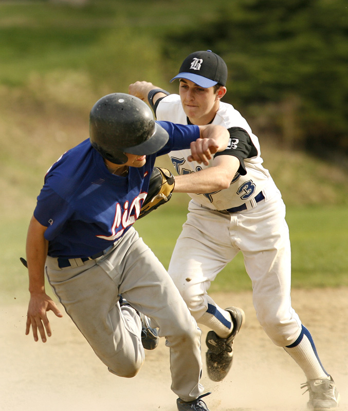 Bromfield shortstop Joe d'Eramo tags out West Boylston's Mike Chevalier after the Lions second baseman was caught in a pickle between second and third basei in the seventh inning. (Photo by Ellen Harasimowicz) Bromfield shortstop Joe d'Eramo tags out West Boylston's Mike Chevalier after the Lions second baseman was caught in a pickle between second and third basei in the seventh inning. (Photo by Ellen Harasimowicz)