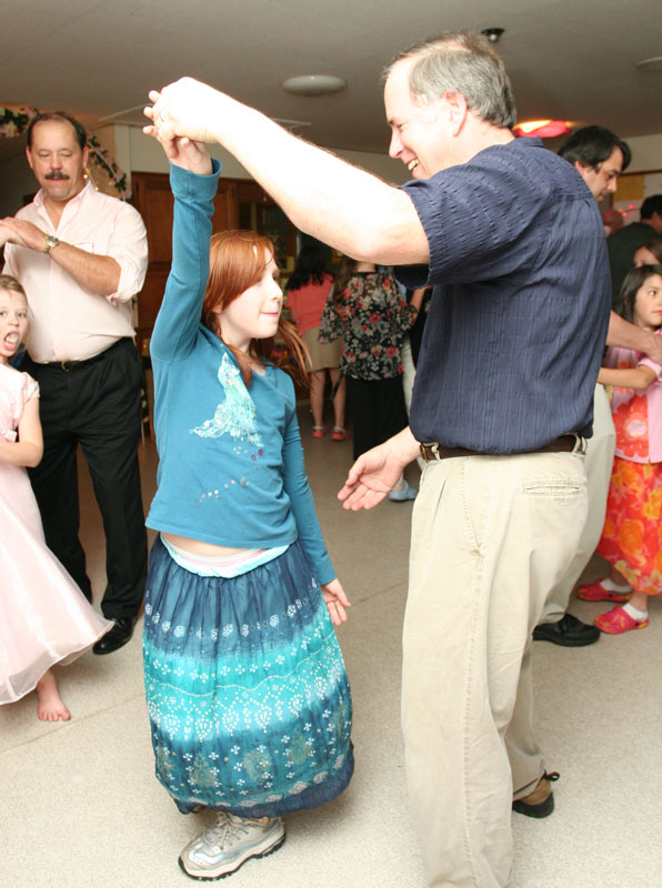 Lauren Beale gets spun by her dad, Nat Beale, at the Father-Daughter dance sponsored by the Girl Scouts last Friday.