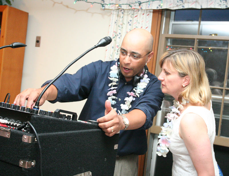 Police Chief Ed Denmark, the D. J. for the event, takes a request from Melissa Marteney.