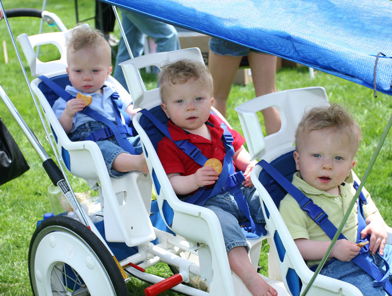 Triplets Cayden, Conlyn, and Kylan Matson enjoy a day out at the festival. Their mother, Heather (Olsen) Matson, is a Bromfield graduate.