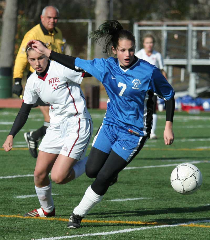 Defender Ali Reusch brings the ball down field against Newburyport.