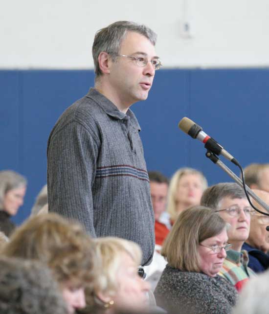 Former town administrator Paul Cohen takes his opinion to the microphone at Town Meeting in March.
