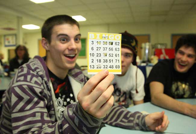 Nick Ashe looks to fill in the top row of his bingo card at the PTO family game night.
