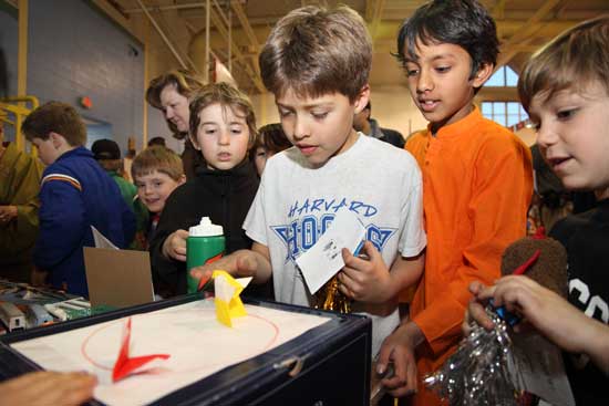 Matthew Carrona, Oliver Smalanskas, Nikhil Kommineni, and Dylan Ashe participate in origami sumo wrestling.