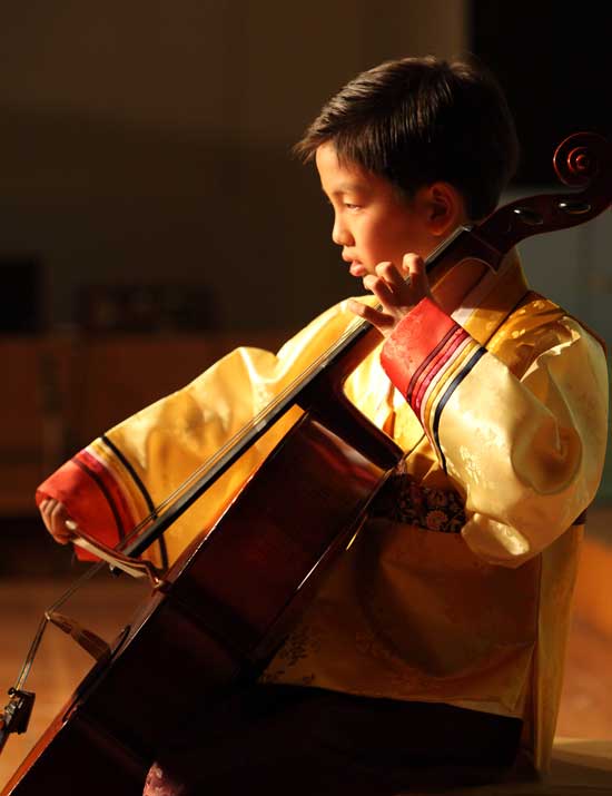 Fourth-grader Kee Hwang Lee performs a traditional Korean song on his cello.
