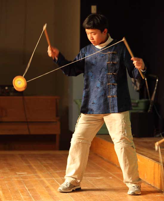 Sixth-grader David Young wows the crowd with his Chinese yo-yo tricks at the HES Festival of Cultures.
