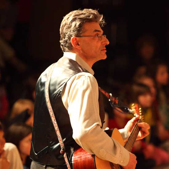 Marc Abouaf leads fourth-grade singers.
