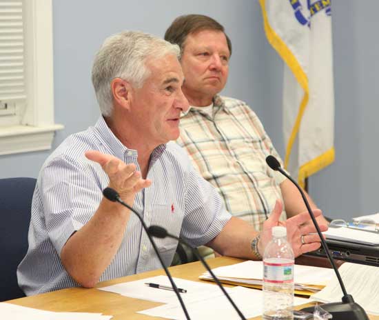 Selectmen Leo Blair (left) and Ron Ricci preside over an April meeting to discuss town center sewer. Blair resigned in August.