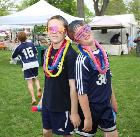 Nick Evans and Riley Sennott pose for the camera.