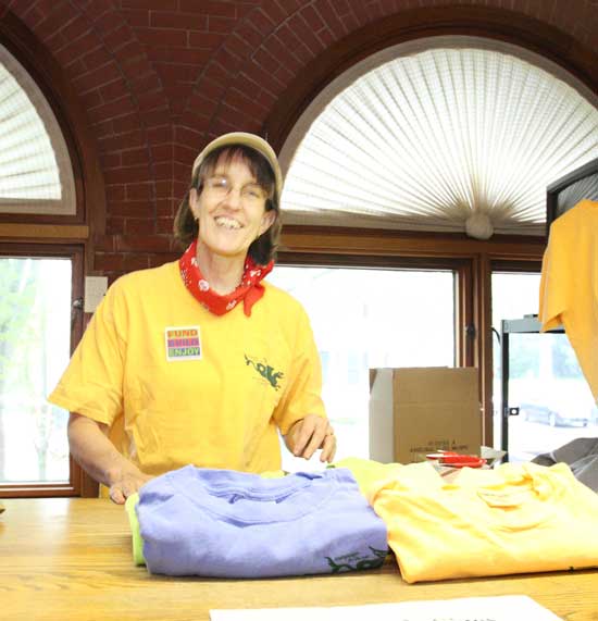 Ginger Kendall sells vintage T-shirts from the fundraising effort that contributed to the building of the new library. 