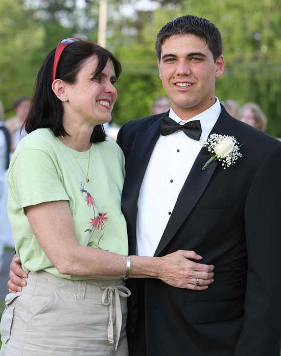 Terry Symula gives son Michael a hug before he heads off to the Bromfield prom.