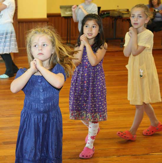 From left: Thea Eiland, Meilei Stanten, and Phoebe Clark practice part of “Dances with Wood,” to be performed at Fruitlands Museum on June 28.