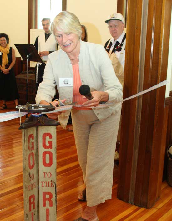 Carlene Phillips, President of the Historical Society, cuts a ribbon to officialy open the new Willard-Scorgie room in June. The expansion of the display space was part of major renovations to the building after a September 2008 fire.