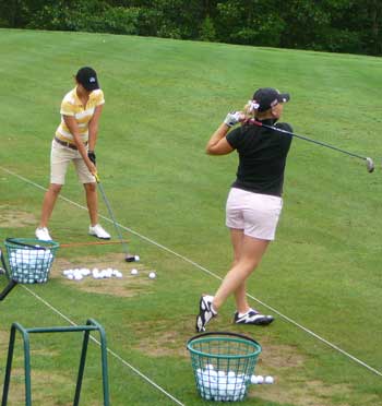 Madison Pressel (far right), sister of LPGA sensation Morgan Pressel, warms up before her qualifying round Tuesday. She fired back-to-back rounds of 75, good enough to qualify for match play. (Photo by Worth Robbins)