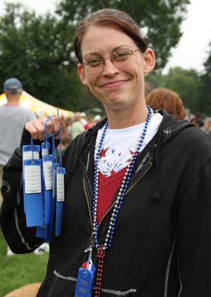 Sarah Maliszewski displays her first place pie-eating ribbons at last year’s Fourth of July celebration. (Photo by Lisa Aciukewicz) Sarah Maliszewski displays her first place pie-eating ribbons at last year’s Fourth of July celebration. (Photo by Lisa Aciukewicz)
