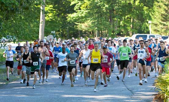 From the start, Daniel Navaroli (190) from Clinton  and Henry Scollard (244) of Cambridge led the Fourth of July road race, finishing first and second respectively. (Photo by Ellen Harasimowicz)
