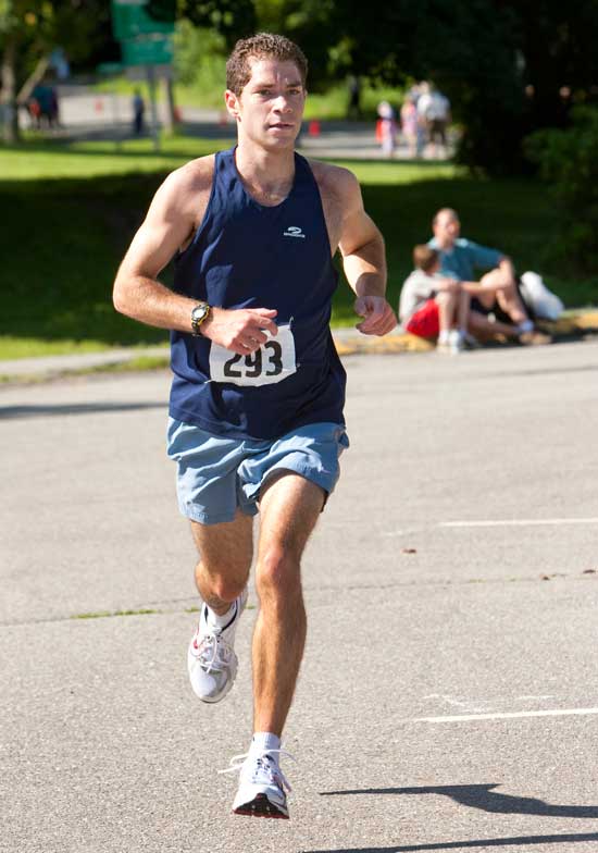 Bromfield alum Nick Parker was the first Harvard resident to cross the finish line of the road race and was sixth overall with a time of 29:33. (Photo by Ellen Harasimowicz)