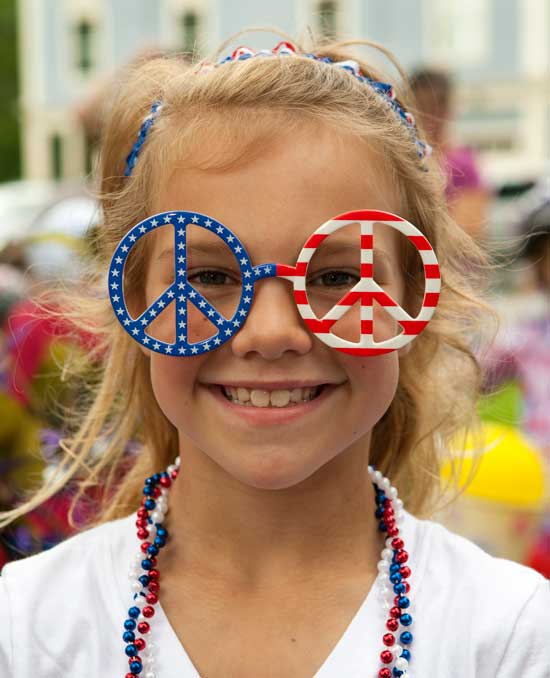 Seven-year-old Kaia Bishop decorated herself for Fourth of July. (Photo by Ellen Harasimowicz)