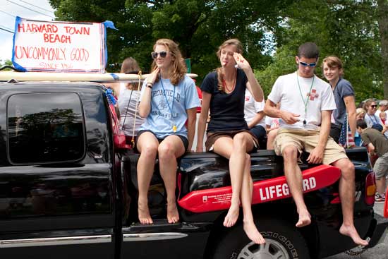 "Uncommonly good" lifeguards ride on the town beach float. (Photo by Ellen Harasimowicz)