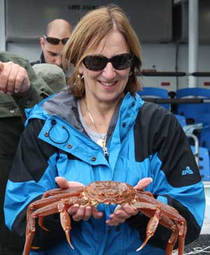 Marilou Spash holds a giant crab in Alaska. Marilou Spash holds a giant crab in Alaska.