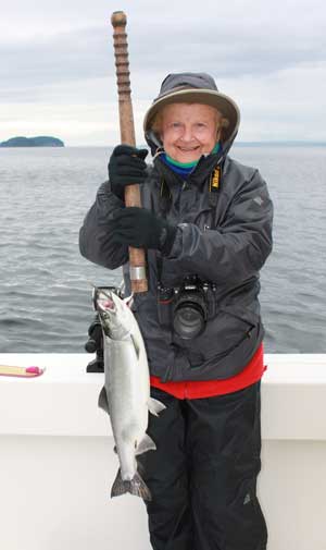 Fisherwoman Joyce Garrick with her salmon. (Photo by Marilou Spash) Fisherwoman Joyce Garrick with her salmon. (Photo by Marilou Spash)
