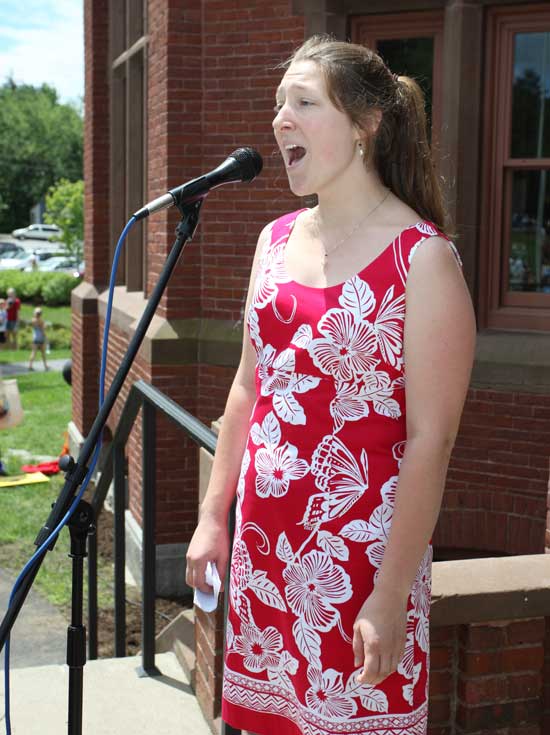 Recent Bromfield graduate Liz Frothingham sings the national anthem. 