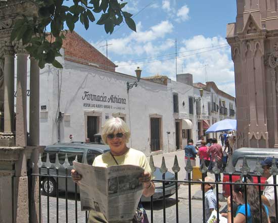 Susan Leeming of Whitney Road studies the Press on a visit to Perez, Mexico. (Courtesy photo)