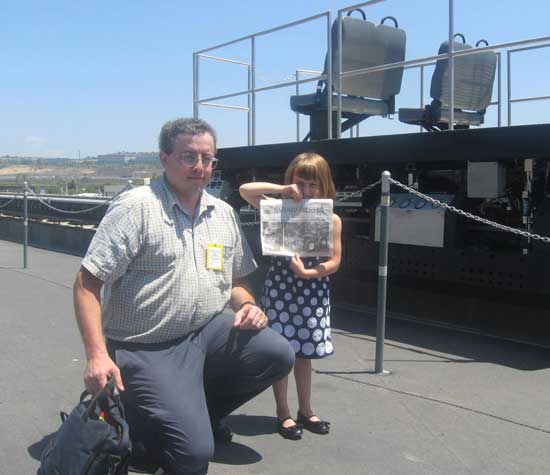 Sophie Thompson and her dad, Marc Thompson, pose with the Press in front of an experimental magnetically levitated train in San Diego, Calif. Marc is a consultant working on the project; Sophie is the youngest passenger yet on the levitated train. (Courtesy photo)