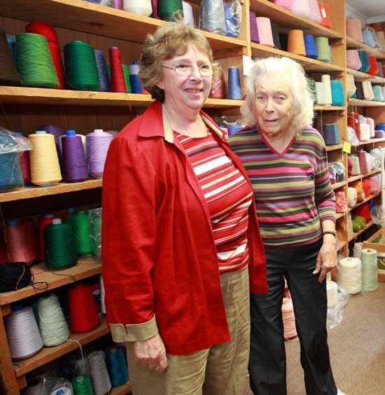 Owner Reba Maisel poseswith customer Rachael Lawrence during an open house celebrating the Fiber Loft's 35th anniversary.