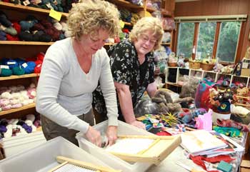 Sandy Daries (left) and Chris Perry try their hands at felting at an exhibit by Sharon Chandler (not shown) at the Fiber Loft’s 35th anniversary open house. (Photo by Lisa Aciuekwicz) Sandy Daries (left) and Chris Perry try their hands at felting at an exhibit by Sharon Chandler (not shown) at the Fiber Loft’s 35th anniversary open house. (Photo by Lisa Aciuekwicz)