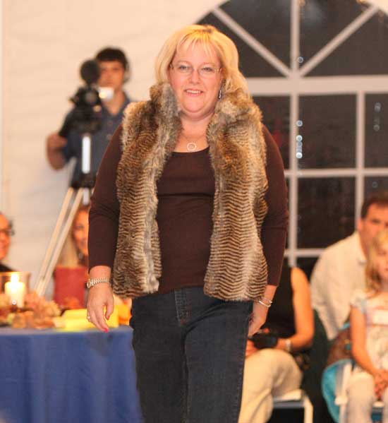 The Rotary Club's Karen Strickland shows off an animal print fur vest by Parkhurst along with a pair of Not Your Daughter's jeans.